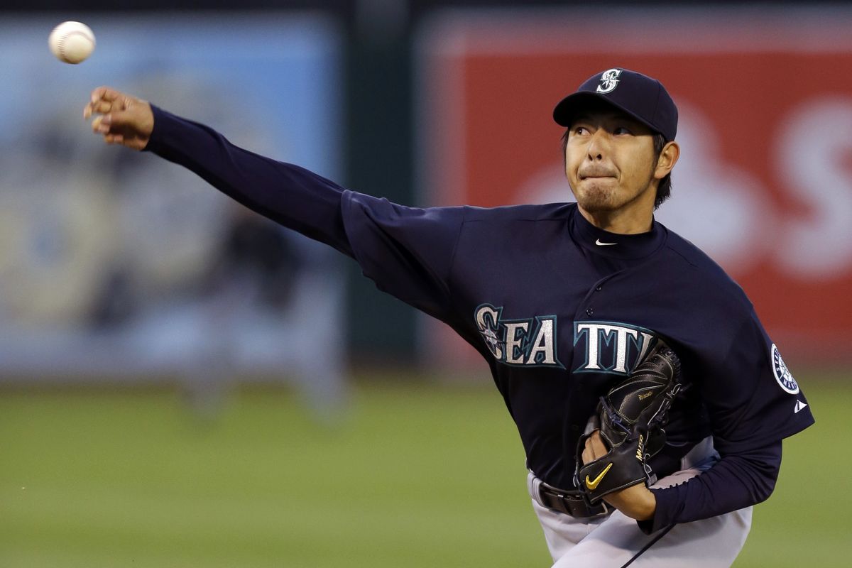 Seattle Mariners' Hisashi Iwakuma works against the Oakland Athletics in his first start of the season. (Associated Press)