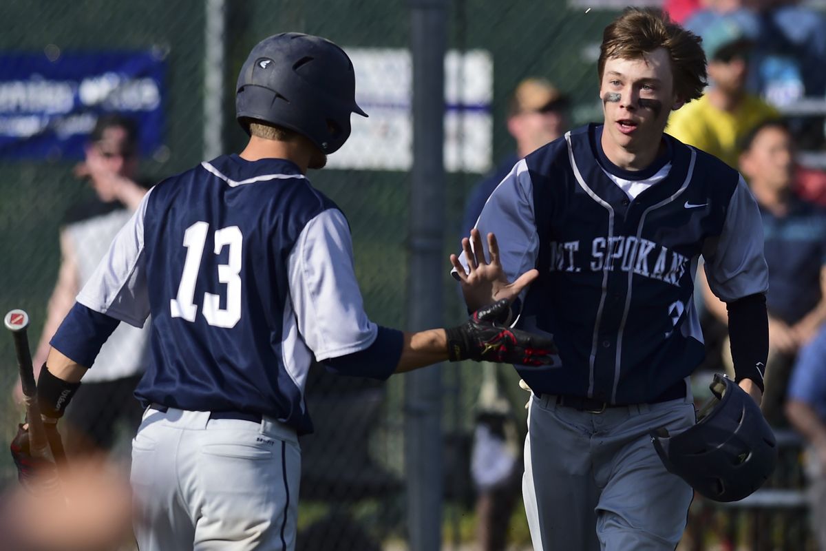 Mt. Spokane’s Michael Walker, right, is congratulated after scoring against Shadle Park on Monday in Wildcats’ 2-0 victory. (Tyler Tjomsland)