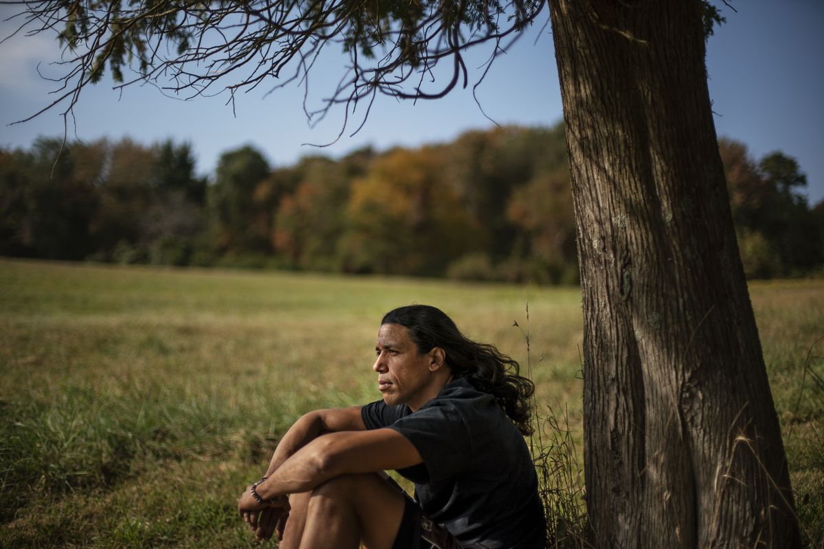 Annawon Weeden, 46, a member of the Mashpee Wampanoag Tribe, sits outside his home in Oakdale, Conn. (David Goldman)