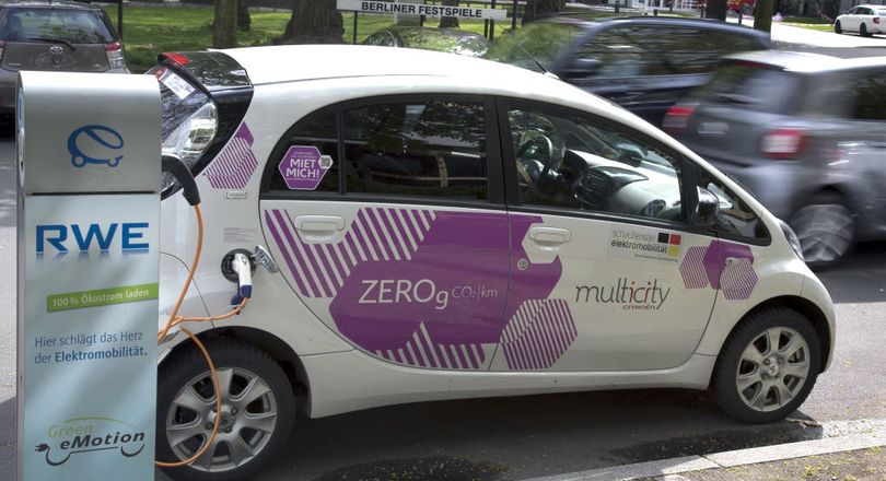 An e-car is connected with a public charge base in Berlin, Germany, April 27, 2016. Germany plans to subsidize electric cars in a bid to help the country's auto industry compete in the global market for the growingly-popular and environmentally friendly vehicles. (AP Photo/Michael Sohn)