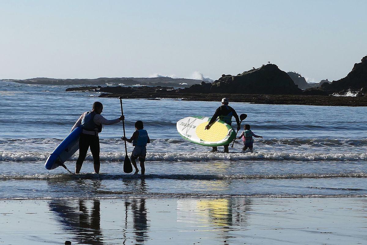 A family gets ready to paddle into the waters of Sunset Bay State Park, near Coos Bay, Ore. (John Nelson)