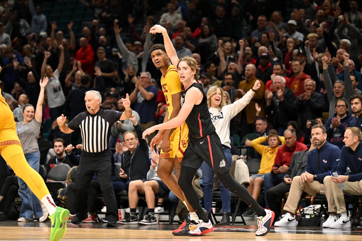USC’s Arrinten Page, background, reacts after Gonzaga guard Dusty Stromer hits a 3-pointer late in the second half Saturday at the MGM Grand Garden Arena in Las Vegas.  (Tyler Tjomsland/The Spokesman-Review)