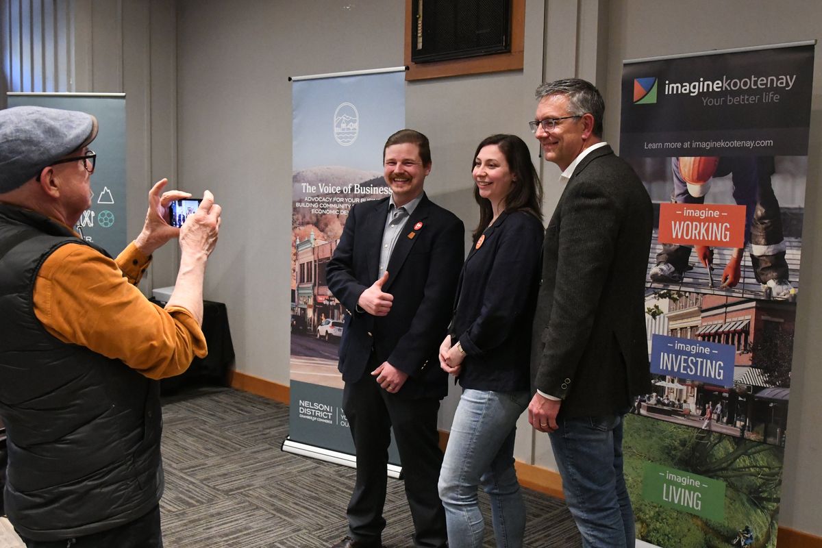 Liberal Party candidate Reggie Goldsbury, left, New Democratic Party candidate Kallee Lins and independent Jim Wiedrick – who each seeks to represent Columbia-Kootenay-Southern Rockies riding in southeast British Columbia – pose for photos after a candidate forum hosted by the Nelson Chamber of Commerce on Wednesday. (James Hanlon/The Spokesman-Revie)