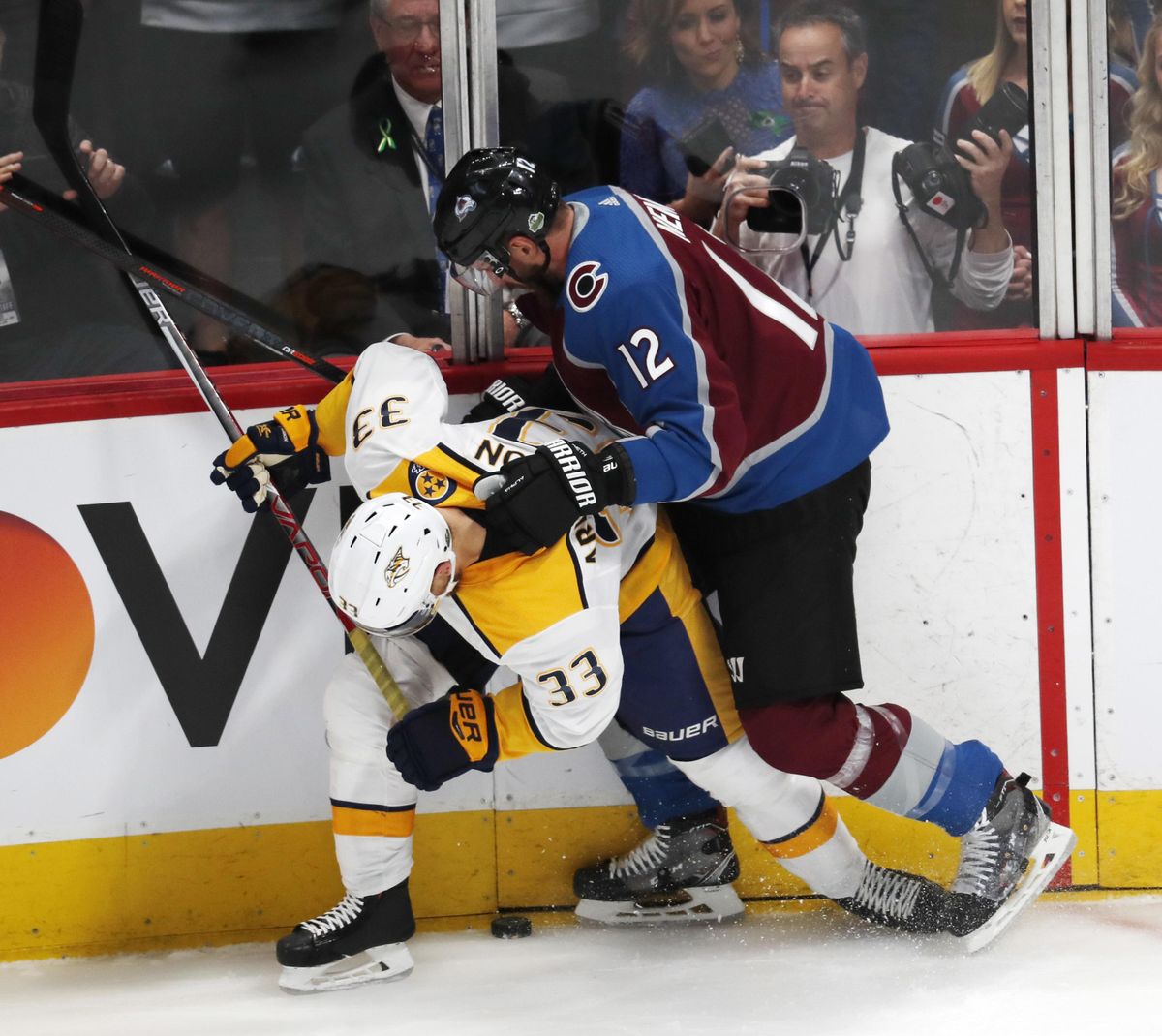 Colorado Avalanche defenseman Patrik Nemeth, hits Nashville Predators left wing Viktor Arvidsson as he tries to control the puck in the first period of Game 3 of an NHL hockey first-round playoff series Monday, April 16, 2018, in Denver. (David Zalubowski / Associated Press)