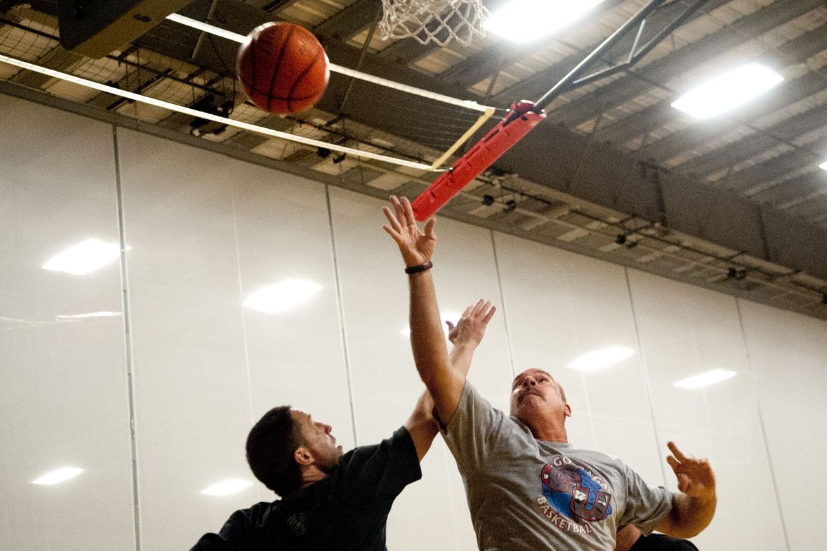 Steve Wilson, right, shoots over Jackson Menke during a pick-up game at the Hub Sports Center in Liberty Lake. (Kathy Plonka)