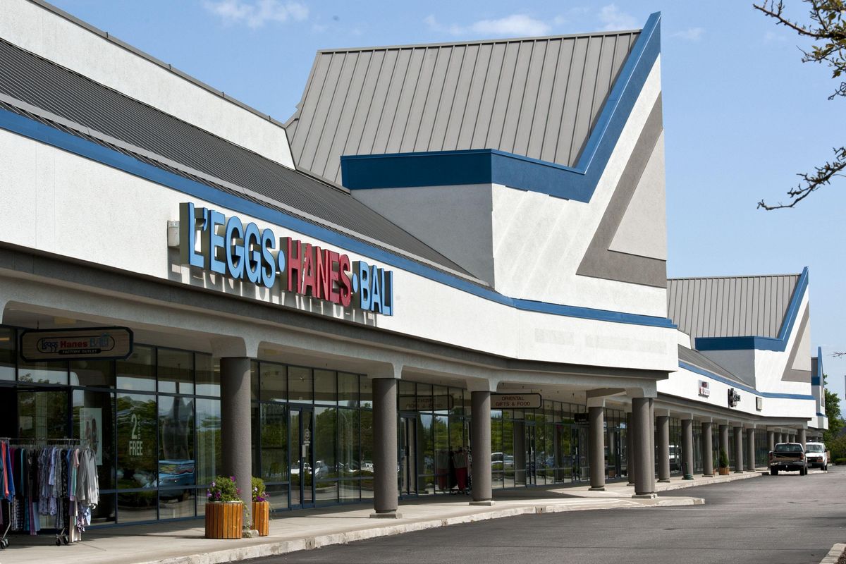 The former Post Falls Factory Outlets site remained vacant for decades. But now, it's bustling with activity and is 95% full since Thomas Tedder purchased the building in 2016. The outlets are photographed on Thursday, August 15, 2019. (Kathy Plonka / The Spokesman-Review)
