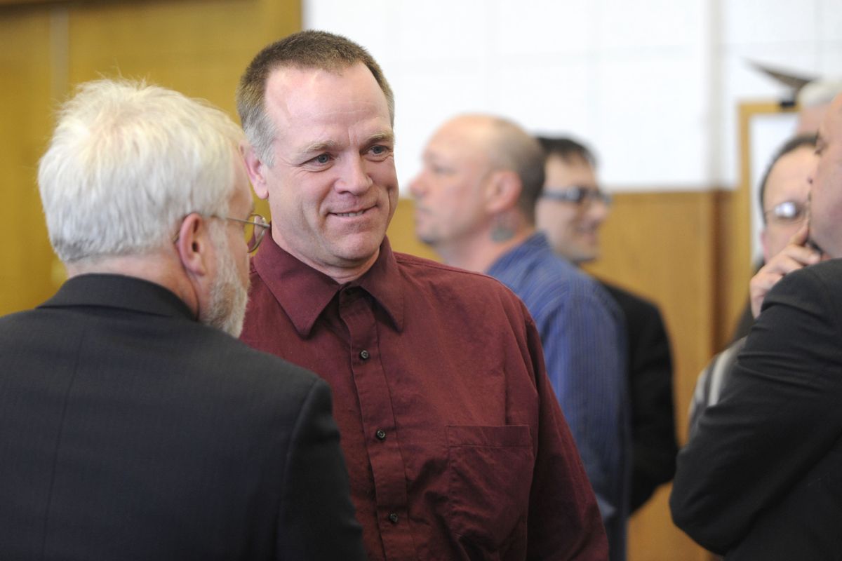 Ira  Tankovich smiles after the verdict is read in a Kootenai County courtroom Monday. Tankovich and two brothers were on trial for malicious harassment, but the jury hung on all counts except one – conspiracy to disturb the peace. At left is defense attorney Brad Chapman. (PHOTOS BY JESSE TINSLEY)