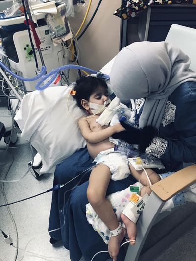 In this Wednesday, Dec. 19, 2018, photo released by the Council on American-Islamic Relations, Sacramento Valley, Shaima Swileh holds her dying 2-year-old son Abdullah at a hospital in Oakland, Calif. (Associated Press)