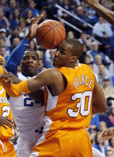 Tennessee’s J.P. Prince takes a basketball off his head Saturday.  (Associated Press)