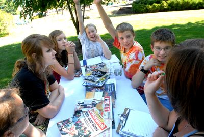From left, Cayle Tetherow, 13; Megan Theobald, 13; Savannah Forno, 13; Daria Greer, 12; Nick Pratt, 13; Matt Trait, 13; and mentor Sarah White brainstorm ideas for a drama presentation at the Young Advocates for Human Rights camp Thursday.  (Jesse Tinsley / The Spokesman-Review)