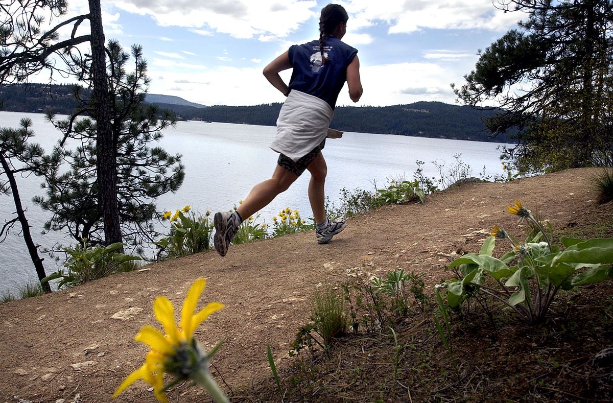 The trail around Tubbs Hill and along Lake Coeur d’Alene is well-worn and suitable for running.  (File / The Spokesman-Review)