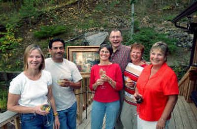 
Members of the North Idaho AIDS Coalition, from left, Cyndi Halgren, Lucien Reyna Jr., Barbara McDaniel, Keith Wolter, Sandra Turtle and Carole Tabakman are organizing a wine-tasting benefit Sunday at the Clark House Bed and Breakfast.
 (Kathy Plonka / The Spokesman-Review)