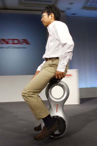 ORG XMIT: XKAN103 A Honda employee demonstrates Honda's new 