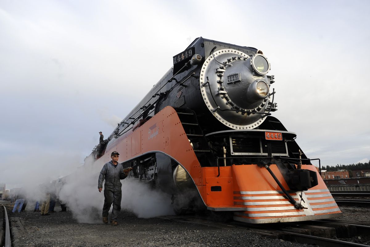 Volunteer crew member Mark Kramer of Portland, Ore. walks around the historic steam engine 4449 of the Southern Pacific Railroad after it stopped in Spokane Monday, Oct. 19, 2009.  Hundreds of buffs are riding the train on its run from Portland, to Minneapolis and back.  
JESSE TINSLEY jesset@spokesman.com (Jesse Tinsley / The Spokesman-Review)
