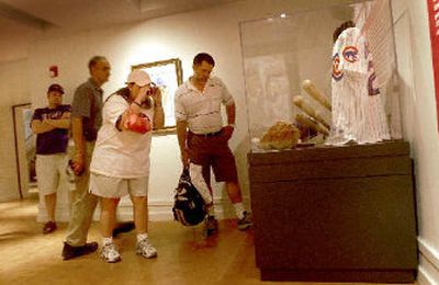 
Fans photograph Ryne Sandberg memorabilia that will become part of his permanent display in Cooperstown.
 (Brian Plonka / The Spokesman-Review)