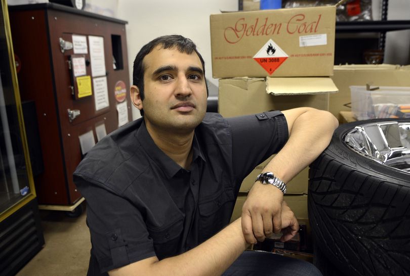 Mohammad Khan, owner of Spokane Cigar, has moved his $33,000 roll-your-own cigarette machine into a back room. (Dan Pelle)