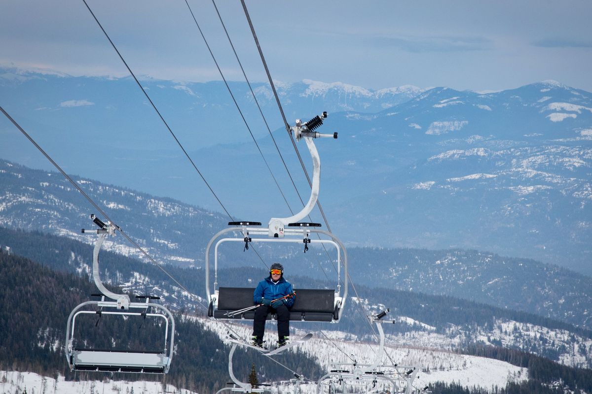 A skier rides up the Cedar Park Express at Schweitzer Mountain in 2020.  (Eli Francovich/The Spokesman-Review)