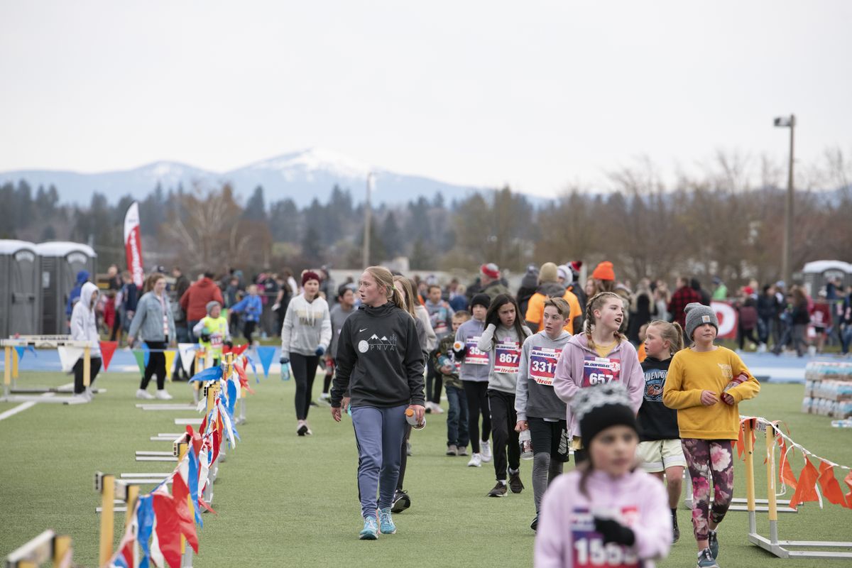 Runners finish on the running track at Junior Bloomsday on Saturday.  (Jesse Tinsley/THE SPOKESMAN-REVIEW)