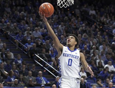 Kentucky's Quade Green scores a layup against Winthrop in November. Green will transfer to Washington. (James Crisp / Associated Press)