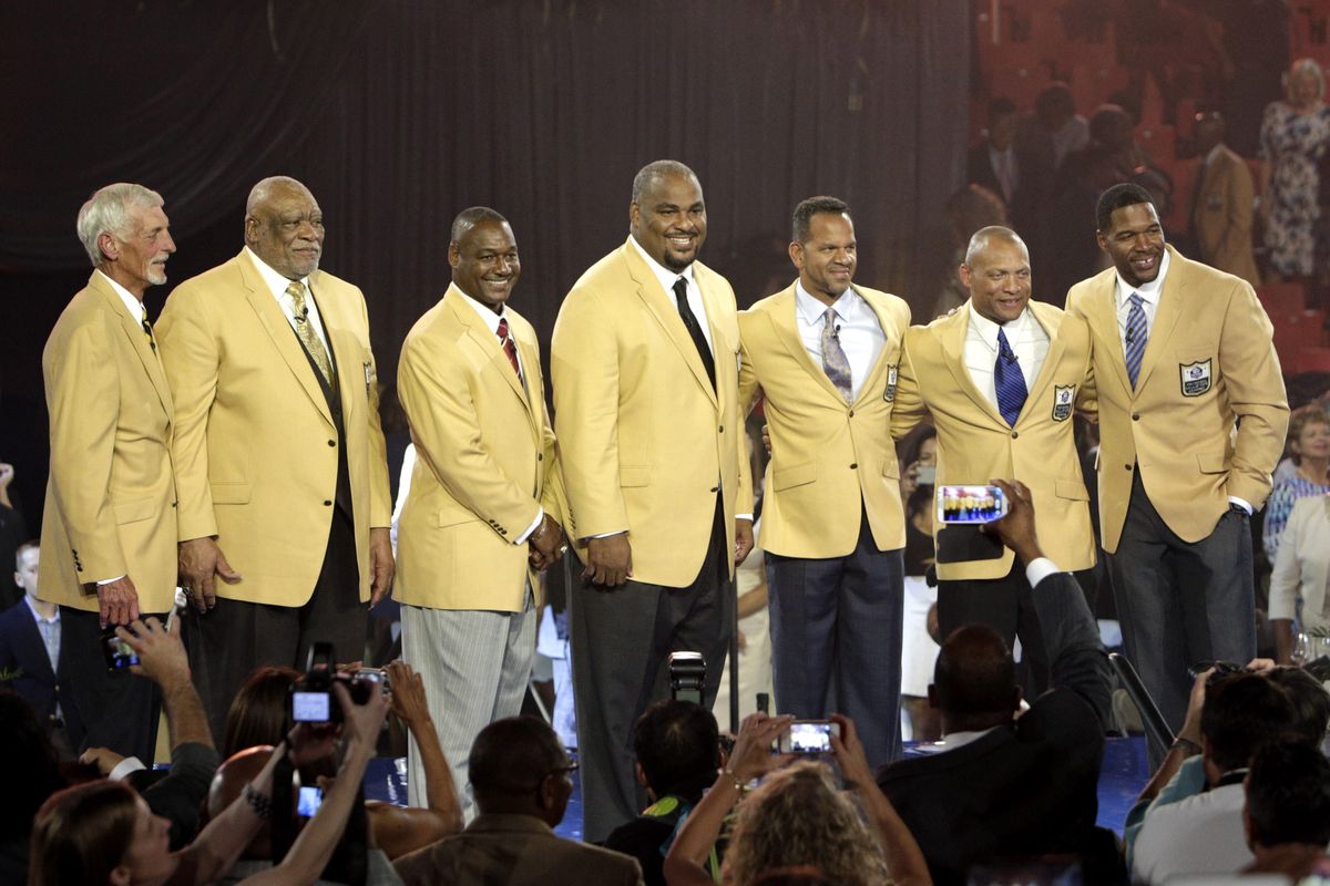 The Class of 2014: Ray Guy, Claude Humphrey, Derrick Brooks, Walter Jones, Andre Reed, Aeneas Williams, and Michael Strahan. (Associated Press)