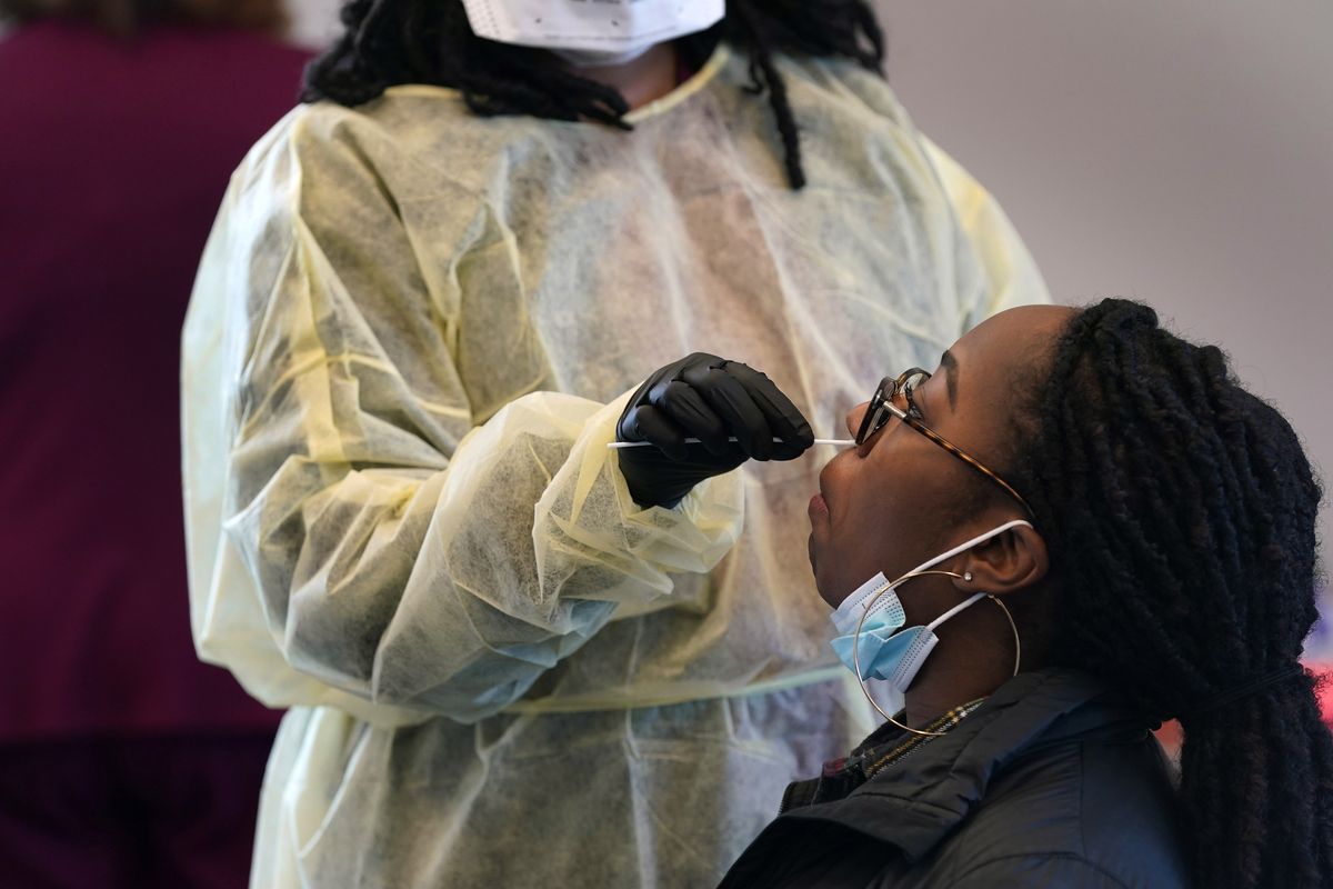 Jazmyn Finney is administered a coronavirus 15-minute rapid test at the student health center on campus at North Carolina Agricultural and Technical State University on Wednesday in Greensboro, N.C.  (Gerry Broome)