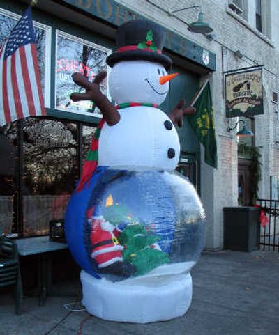 
This 10-foot snowman was recently kidnapped from O'Doherty's Irish Grille and ransomed back to the owner. 
 (Mike  Prager / The Spokesman-Review)