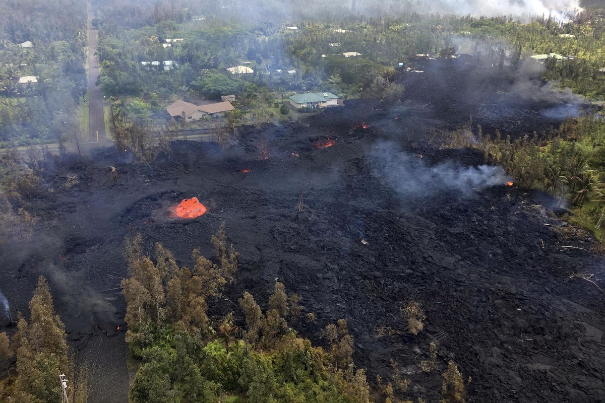 This Saturday, May 5, 2018, photo provided by the U.S. Geological Survey, shows Fissure 7 in Pahoa, Hawaii. At the peak of its activity, large bubble bursts occurred at one spot, lower left, in the fissure while spattering was present in other portions. (AP)