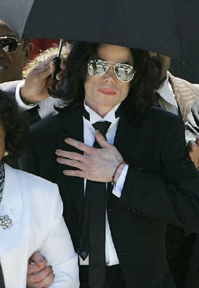 
Michael Jackson leaves the Santa Barbara County Courthouse in Santa Maria, Calif., on Monday. The jury in the Jackson child-molestation case found the pop star not guilty on all counts. 
 (Associated Press / The Spokesman-Review)