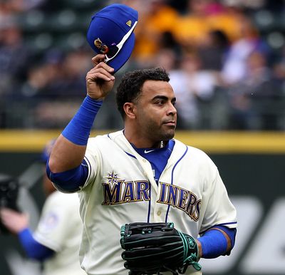 Seattle Mariners right fielder Nelson Cruz tips his cap to a cheering crowd after Ben Gamel was called in to replace Cruz in right field in the fourth inning against the Texas Rangers on Sept. 30, 2018, in Seattle.  (Tribune News Service)