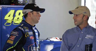 
Defending NASCAR champion Jimmie Johnson, left, and crew chief Chad Knaus discuss Monday's practice session at Daytona. Associated Press
 (Associated Press / The Spokesman-Review)