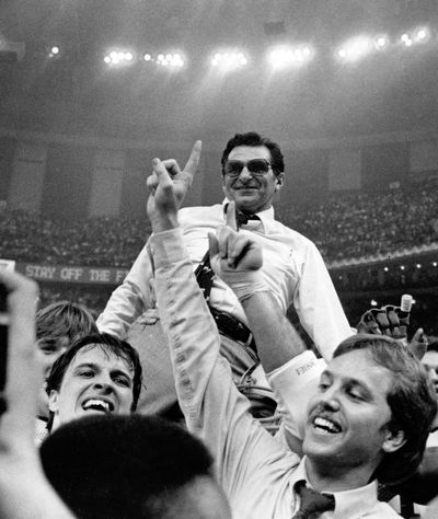Penn State coach Joe Paterno takes a victory ride from his players after defeating Georgia 27-23 in the Sugar Bowl on Jan. 1, 1983 to win the national championship for the first time. Paterno’s Nittany Lions also won the 1986 national championship and finished undefeated five times. His 409 career victories are the most in major college football history. (Associated Press)