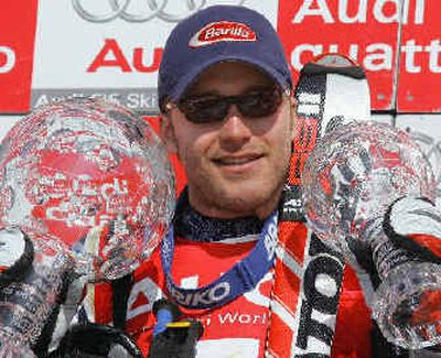
Miller displays the trophies for his overall victory and for Friday's super-G victory in Switzerland
 (Associated Press / The Spokesman-Review)