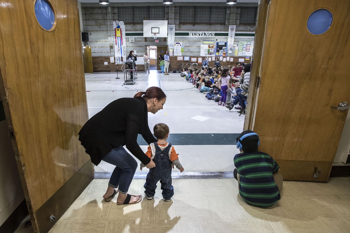 Jenna Alfrey introduces her son, Kingston, age 22 months, to the entire Madison Elementary School student body, April 11, 2017, in Spokane, Wash, Alfrey talked to the students about her son and his life with Down syndrome. The Spokane Guilds’ School has provided Kingston with the help he needs. (Dan Pelle / The Spokesman-Review)
