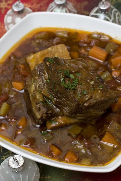 A slow cooked roast or  these Stout-Braised Short Ribs can help lower kitchen stress during this busy time of year.  (Associated Press)