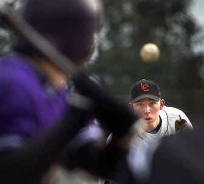 
Lewis and Clark pitcher Eric Barge delivers a pitch during a recent game against Rogers. Barge has overcome a disability to shine on the diamond.
 (Brian Plonka / The Spokesman-Review)