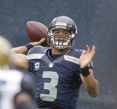 Russell Wilson was on target Sunday, throwing four touchdown passes in the Seahawks' rout of Jacksonville.
 (Stephen Brashear / Fr159797 Ap)