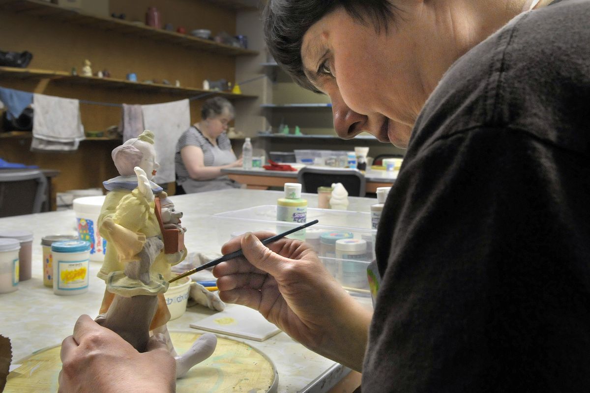 Beth Myers works on a ceramic of a circus clown at Center Pointe April 27.