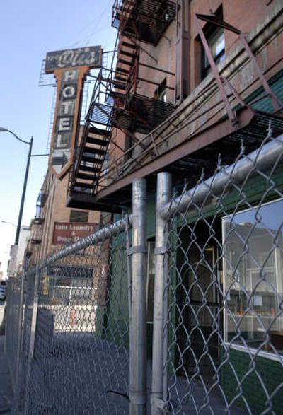
A construction fence has been placed around the Otis Hotel on First Avenue in Spokane.  
 (Dan Pelle / The Spokesman-Review)