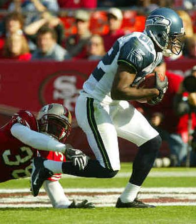 
Seahawks receiver Darrell Jackson scores in the first quarter.
 (Associated Press / The Spokesman-Review)