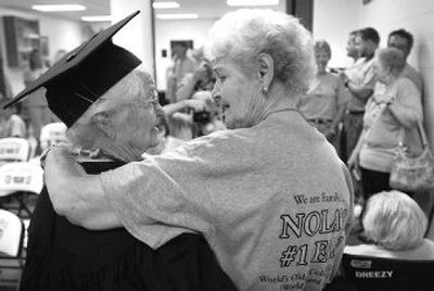 
 Elma Briggs, right, hugs her cousin, Nola Ochs, 95, after Fort Hays State University's commencement Saturday. 
 (Associated Press / The Spokesman-Review)