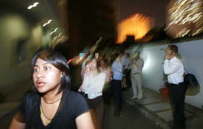 
Indonesian office workers evacuate their building following a magnitude-7.9 earthquake in Jakarta, Indonesia, on Wednesday. The quake off western Indonesia triggered tsunami warnings. Associated Press
 (Associated Press / The Spokesman-Review)