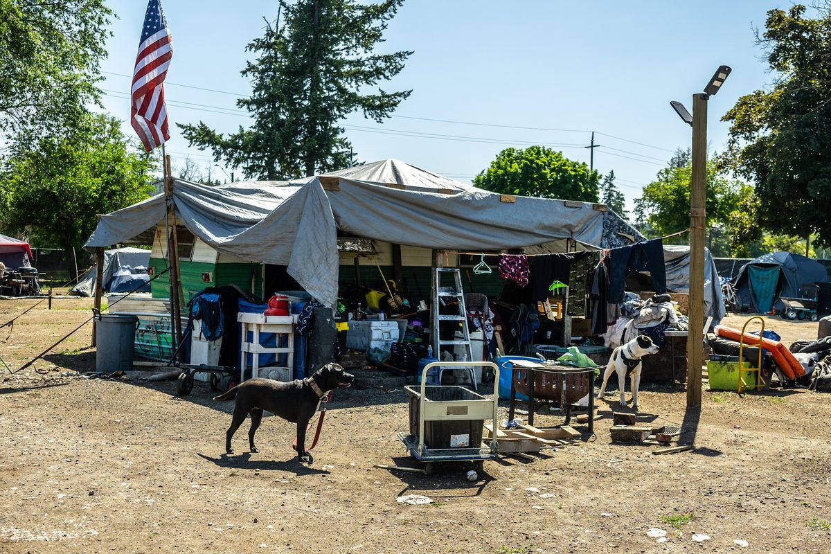 The city of Spokane and Washington state have agreed that Camp Hope, where fewer than 20 people remain, will close by the end of June.  (COLIN MULVANY/THE SPOKESMAN-REVI)