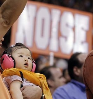 Christina Hu, 11 months, from Scottsdale, Ariz. wears hearing protection during the second half of Game 4 of the NBA basketball Western Conference finals between the Los Angeles Lakers and the Phoenix Suns Tuesday, May 25, 2010, in Phoenix. The Suns won 115-106 to even the series. (Chris Carlson / Associated Press)