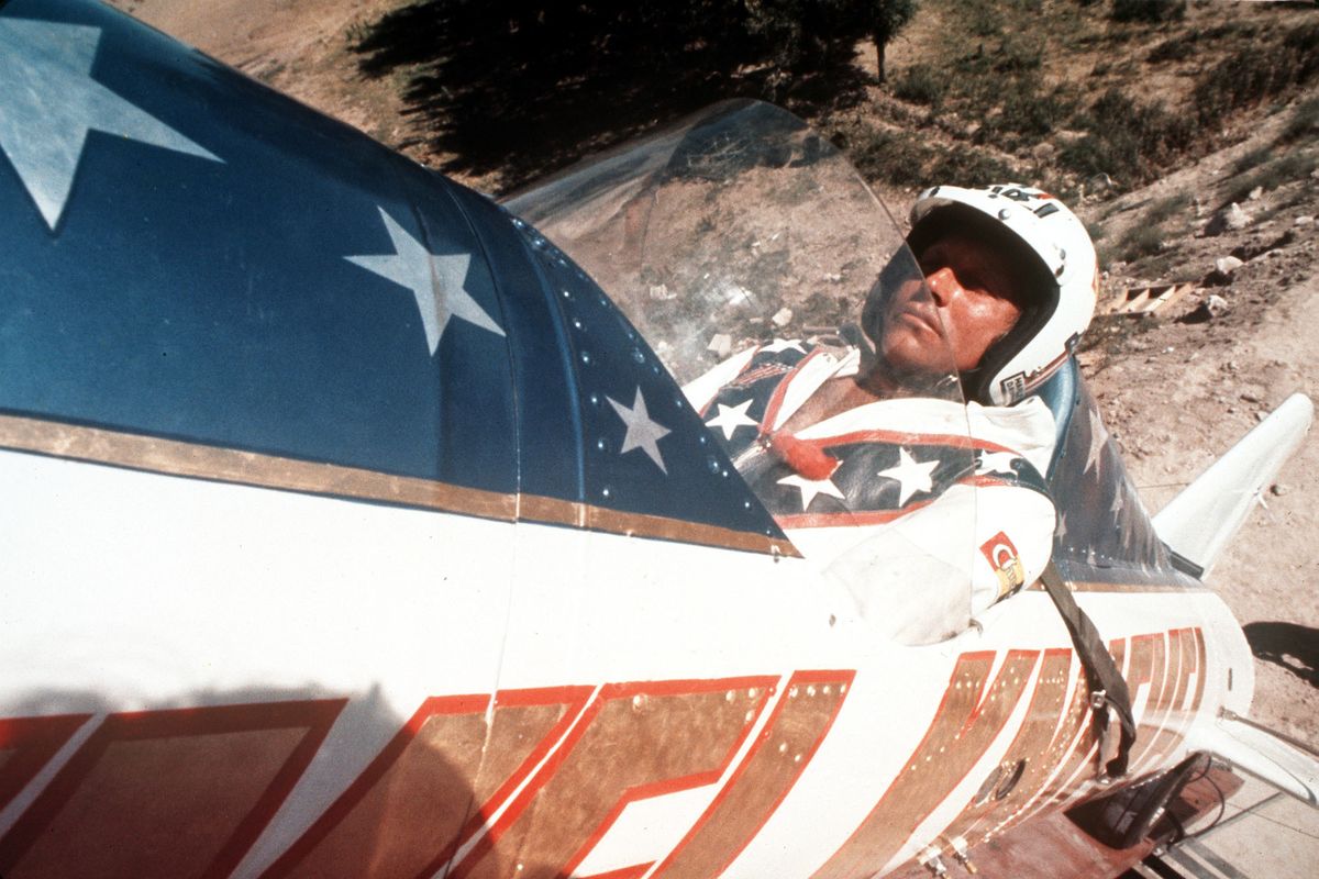 FILE - In this Sept. 8, 1974, file photo, Evel Knievel sits in the steam powered rocket motorcycle that will hopefully take him across Snake River Canyon in Twin Falls, Idaho. A judge has dismissed a trademark infringement lawsuit filed by Evel Knievel’s son against the Walt Disney Co. and movie company Pixar over a “Toy Story 4” daredevil character named Duke Caboom. Kelly Knievel said Monday, Sept. 27, 2021, he