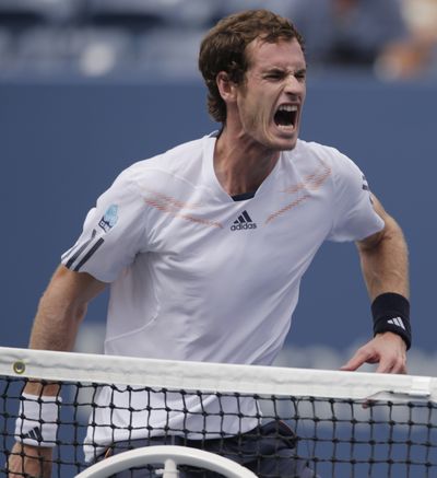 Britain’s Andy Murray got past awful weather and Czech Republic’s Tomas Berdych to win a semifinal. (Associated Press)
