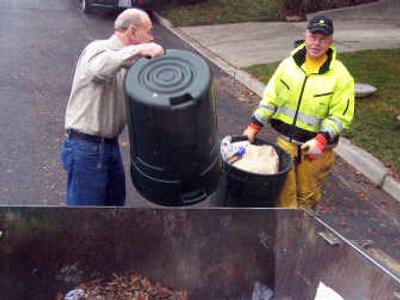 
Jackson  Kile, right, has helped dispose of most of Cheney's garbage for 37 years and is known for going out of his way to help remove trash. 
