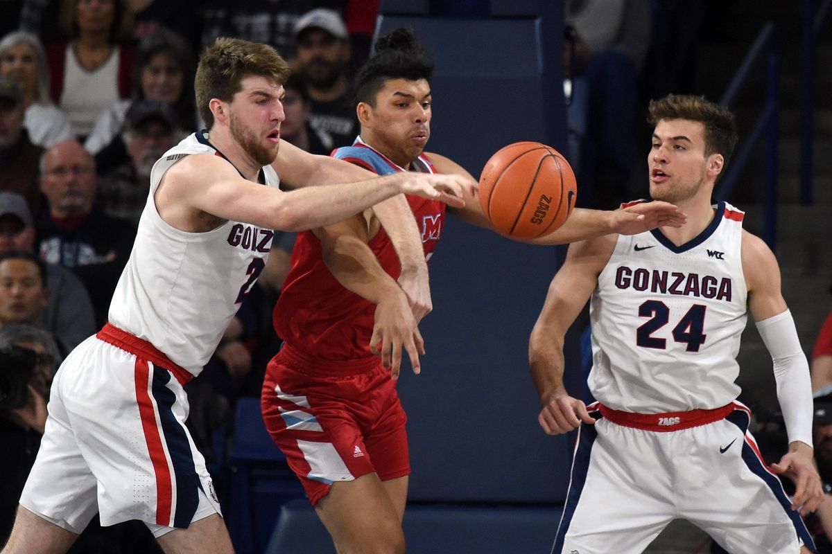 Gonzaga forward Drew Timme (2) strips the ball away from Loyola Marymount Lions forward Keli Leaupepe (34) during the first half of a college basketball game, Thurs., Feb. 6, 2020, at the McCarthey Athletic Center. (Colin Mulvany / The Spokesman-Review)