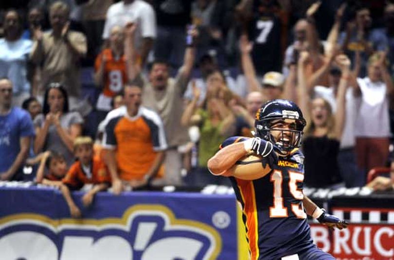 Spokane's Raul Vijil wears a grin as he scampers into the end zone with just seconds left in the first half, making it 28-28 against a tough Wilkes-Barre/Scranton team Saturday, July 11, 2009, at the Spokane Arena. (Jesse Tinsley / The Spokesman-Review)