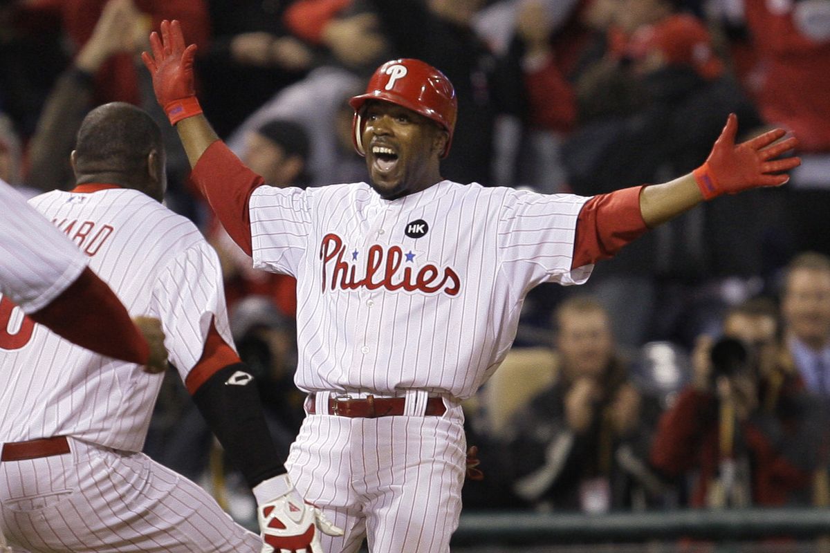 Jimmy Rollins celebrates his game winning two-run double in the ninth. (Associated Press / The Spokesman-Review)