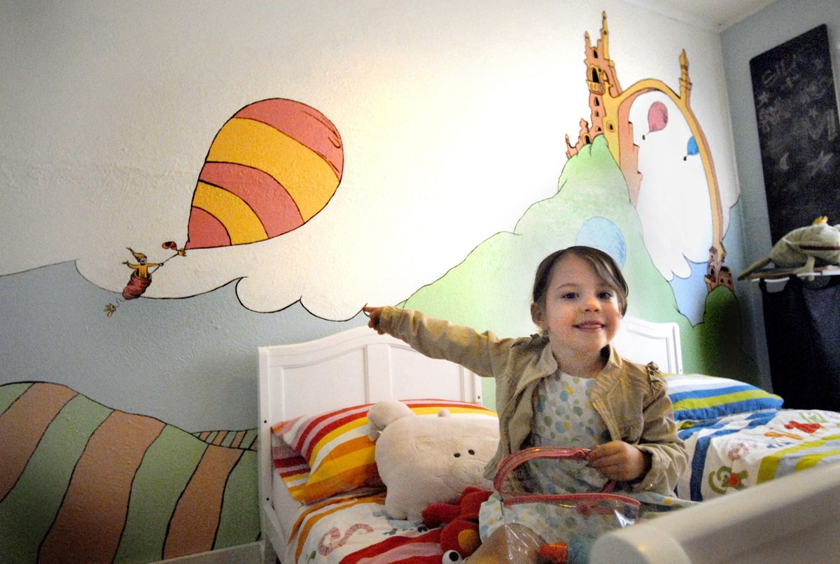 Amelie Johnson, 4, points to the mural in her bedroom. Amelie’s mother, Carolina Nowak, painted the mural from a scene in the Dr. Seuss book “Oh, The Places You’ll Go!” (Kate Clark / The Spokesman-Review)